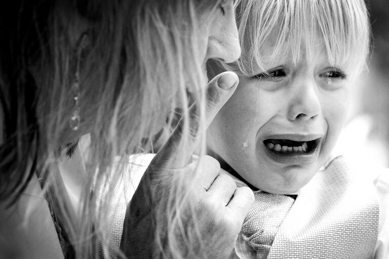 A flower girl in tears, comforted mid-step, The Studio Without Walls