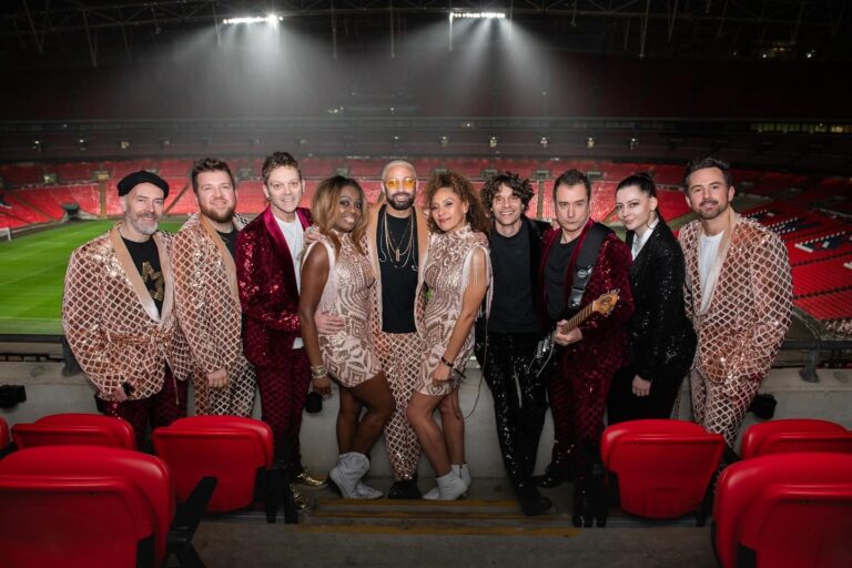 The band posed in the stands at Wembley Stadium, The Sway Allstars