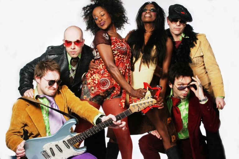 Band members in colourful costumes in a studio photograph, The Sway Allstars