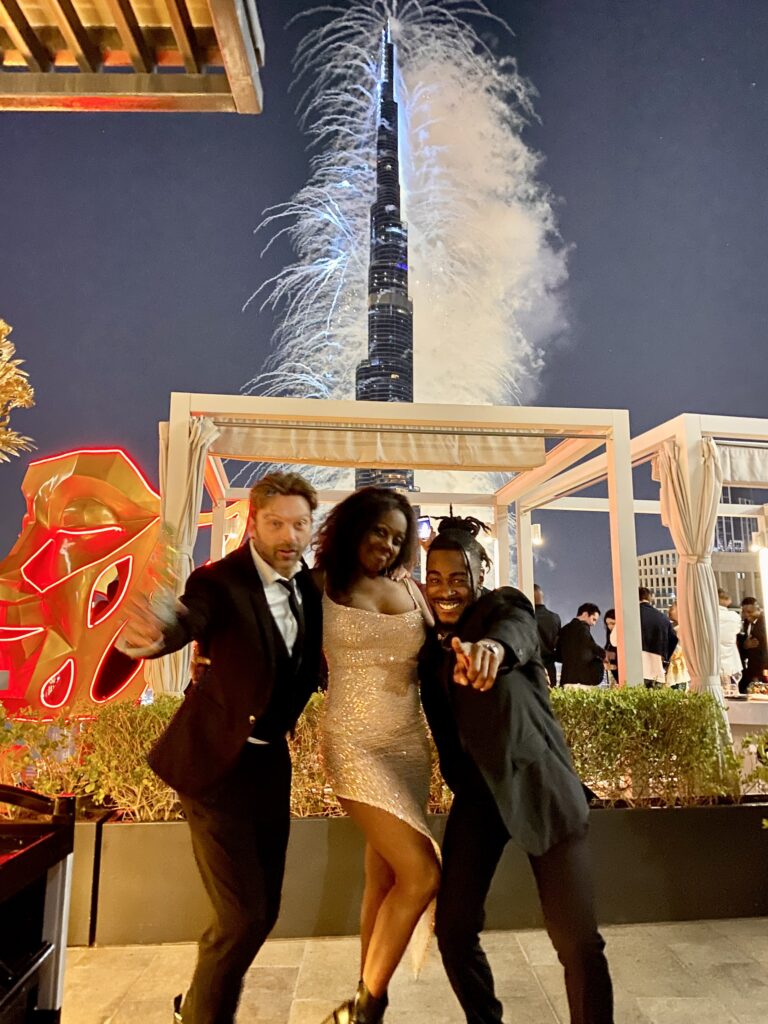 Band members at a rooftop party with the Burj Khalifa behind, The Sway Allstars