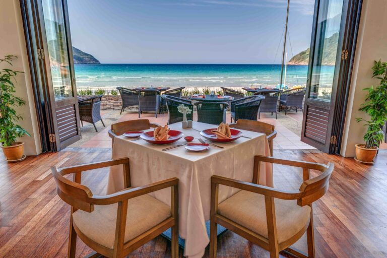 MareNero restaurant table facing the beach, The Taaras Beach and Spa Resort