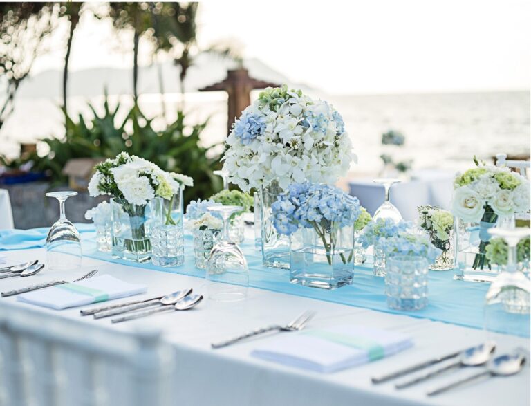 Beach reception table set with blue and white florals, The Taaras Beach and Spa Resort