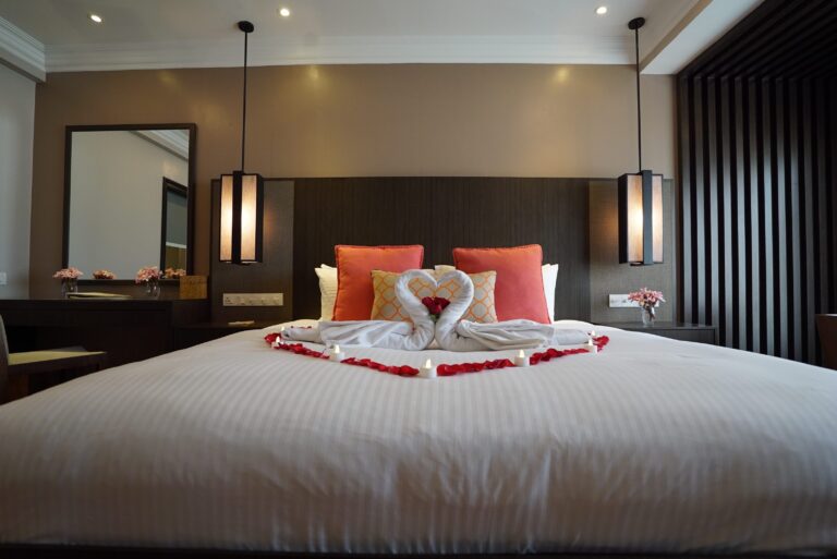 Honeymoon suite bed with towel swans and petals, The Taaras Beach and Spa Resort