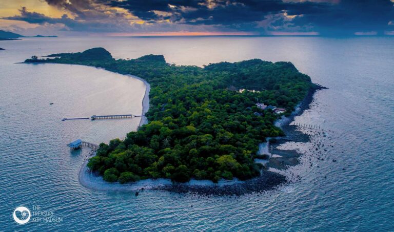 Koh Madsum at dusk from the air, with the jetty at the water's edge, The Treasure Resort Koh Madsum - Samui