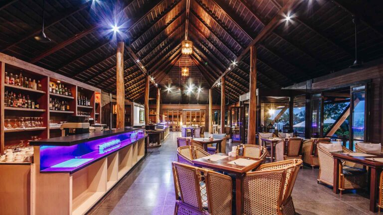The resort restaurant with its timber roof, bar and dining tables, The Treasure Resort Koh Madsum - Samui