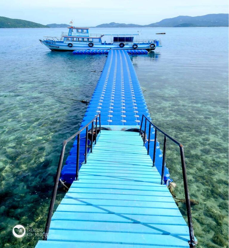 The floating pier leading out to the resort boat over clear water, The Treasure Resort Koh Madsum - Samui