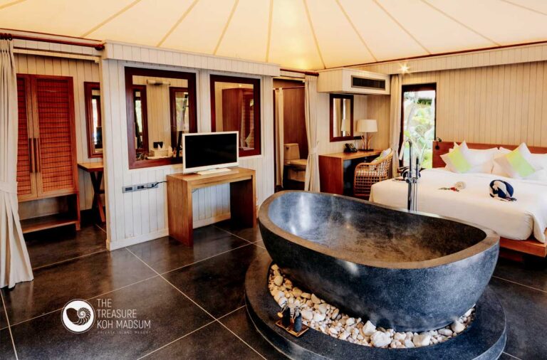 Tented Villa interior with a carved stone soaking bath and king bed, The Treasure Resort Koh Madsum - Samui