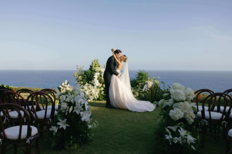 Couple on the clifftop lawn aisle, The Ungasan Clifftop Resort
