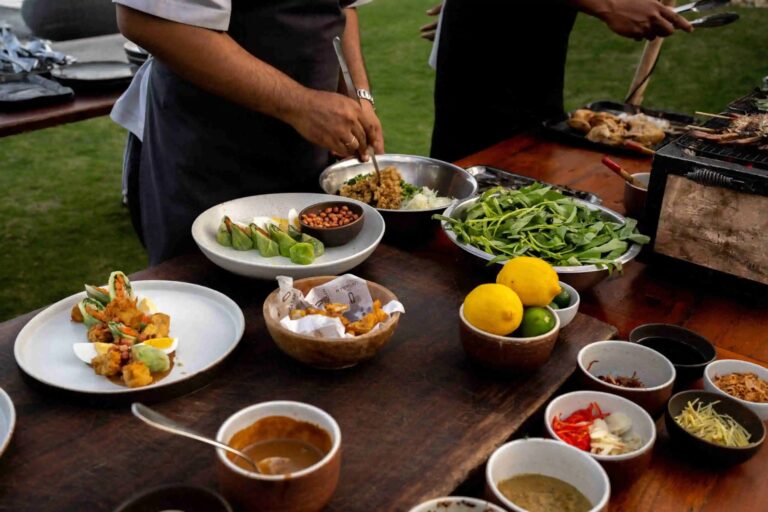 Chefs plating dishes at a live kitchen setup, The Ungasan Clifftop Resort