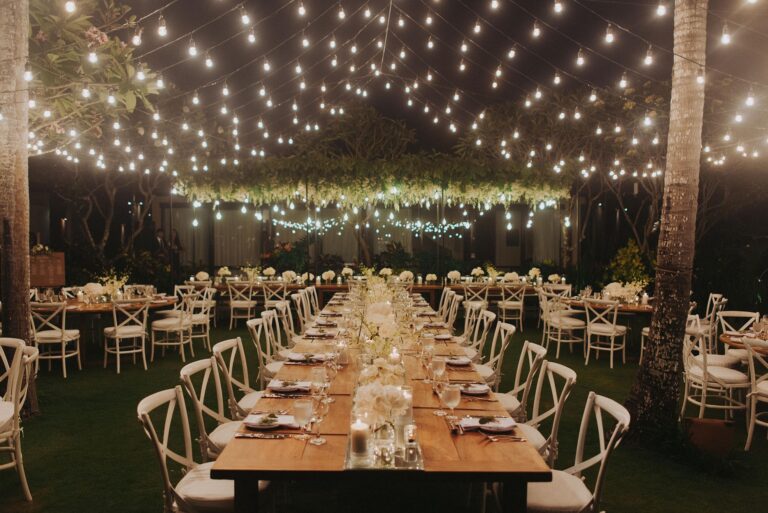 Evening dinner under festoon lights, The Ungasan Clifftop Resort