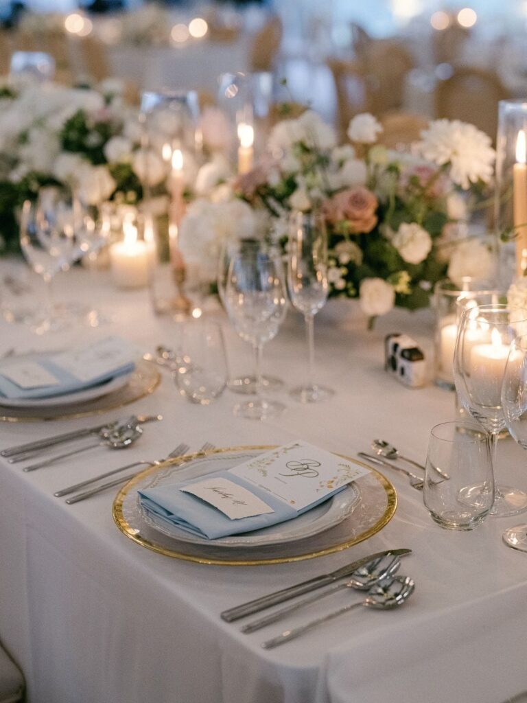 A dinner table with place settings and flowers, The Vanderbilt Estate