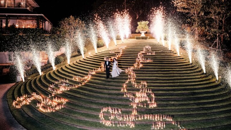 Candlelight and fireworks on the terraced lawn steps during a wedding, The Vanderbilt Estate