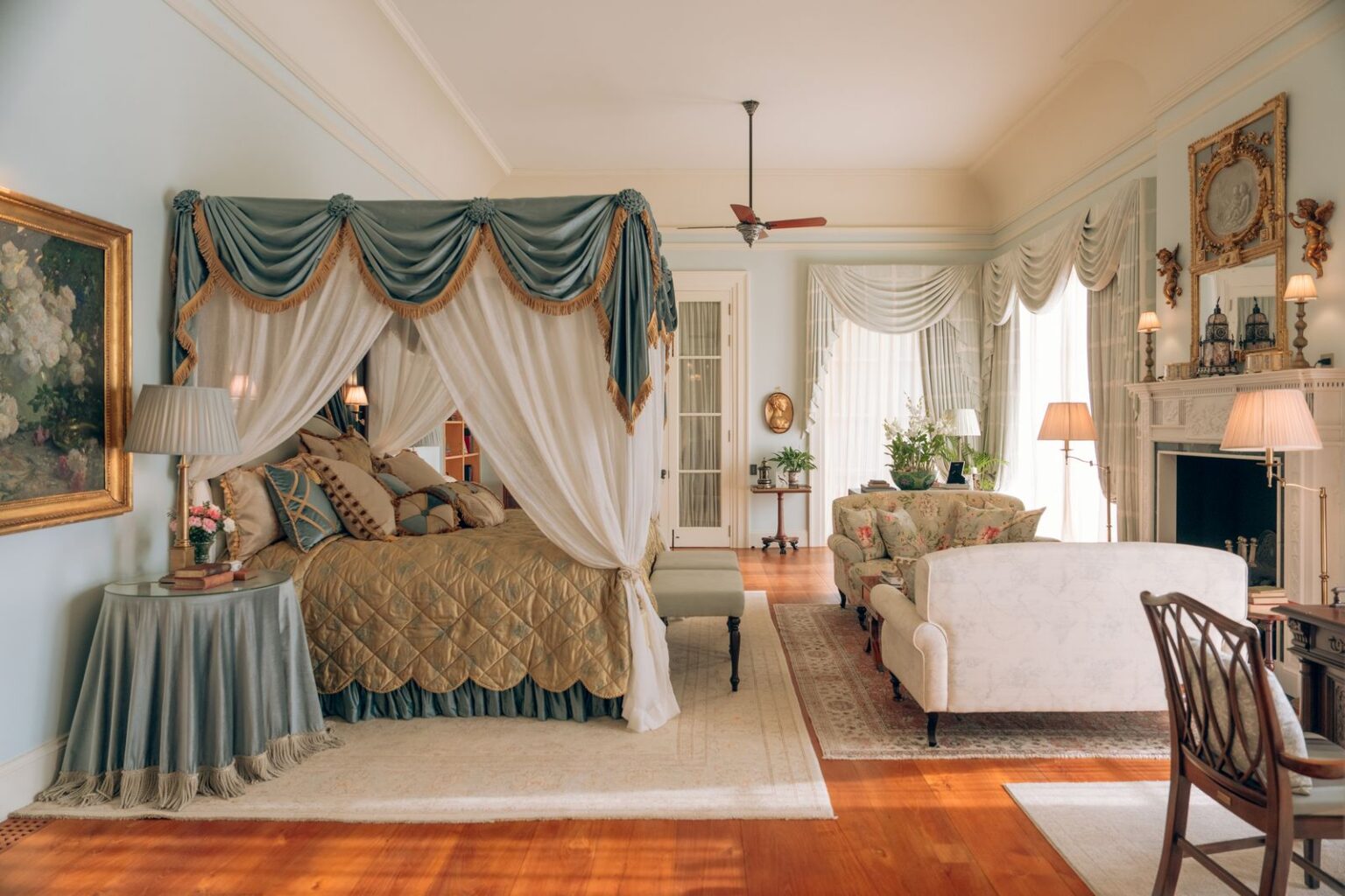 An upper floor suite with a canopy bed