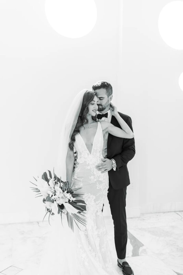 A bride and groom in white, The Wedding Atelier