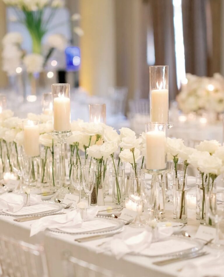 A long table set with candles and white flowers, The Wedding Atelier