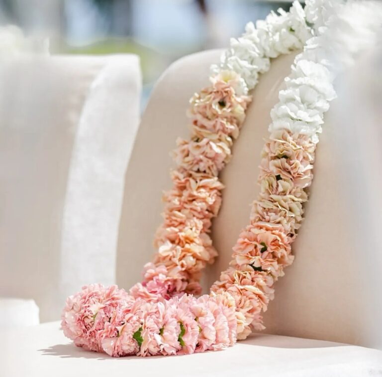 A flower garland in pink and peach, The Wedding Atelier