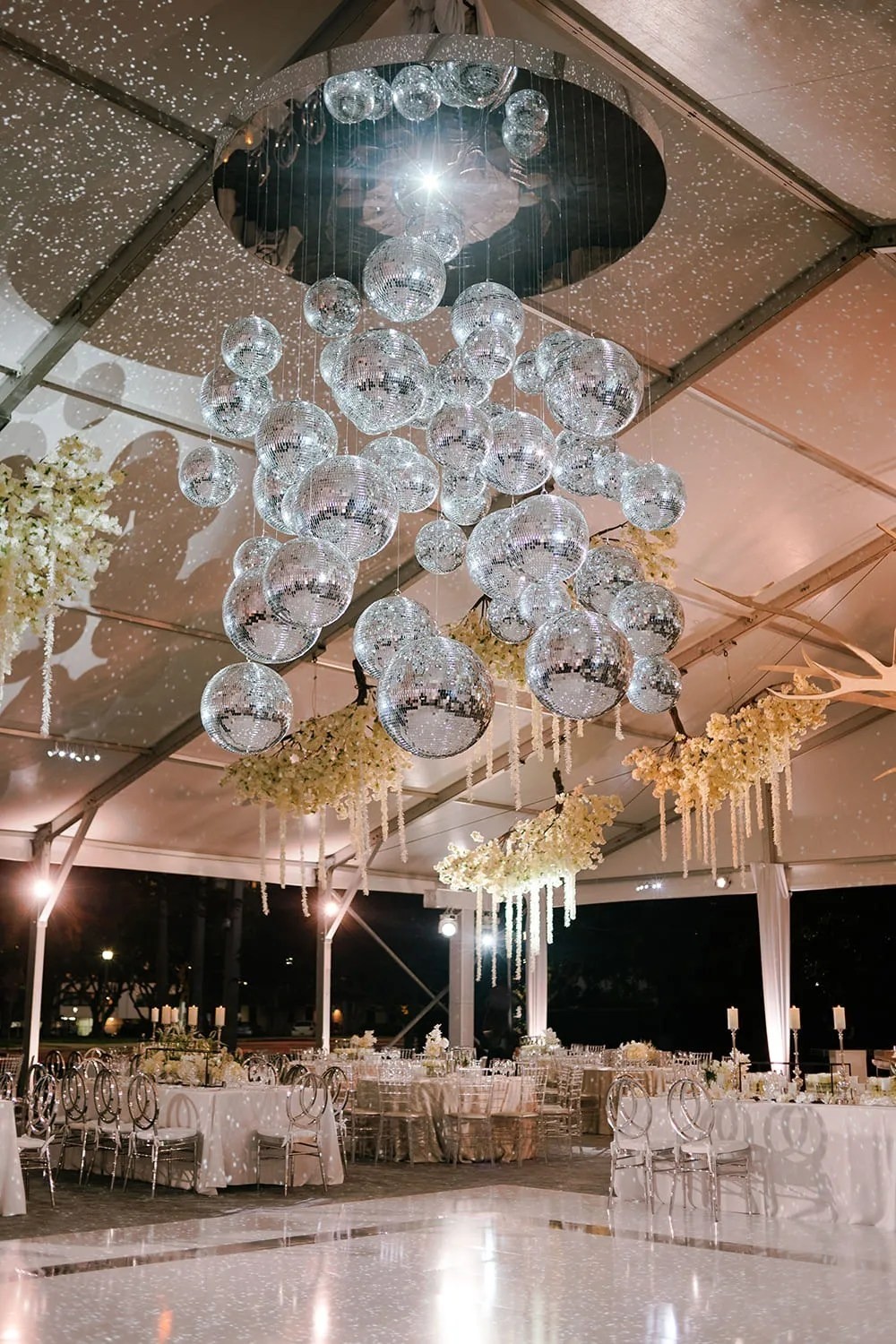 A crystal chandelier over a wedding reception, The Wedding Atelier