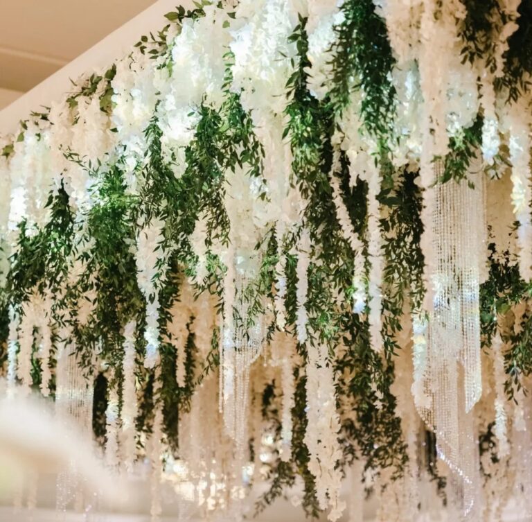 Hanging flowers over a reception, The Wedding Atelier