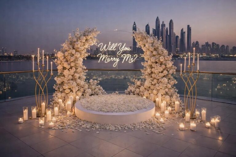 An arch of flowers and candles beside the Dubai skyline, The Wedding Atelier