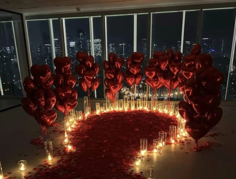 A heart of rose petals and candles for a proposal, The Wedding Atelier