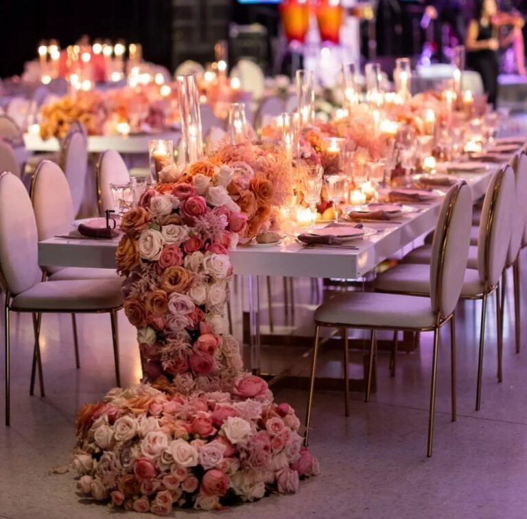 A pink tablescape with flowers and candles, The Wedding Atelier