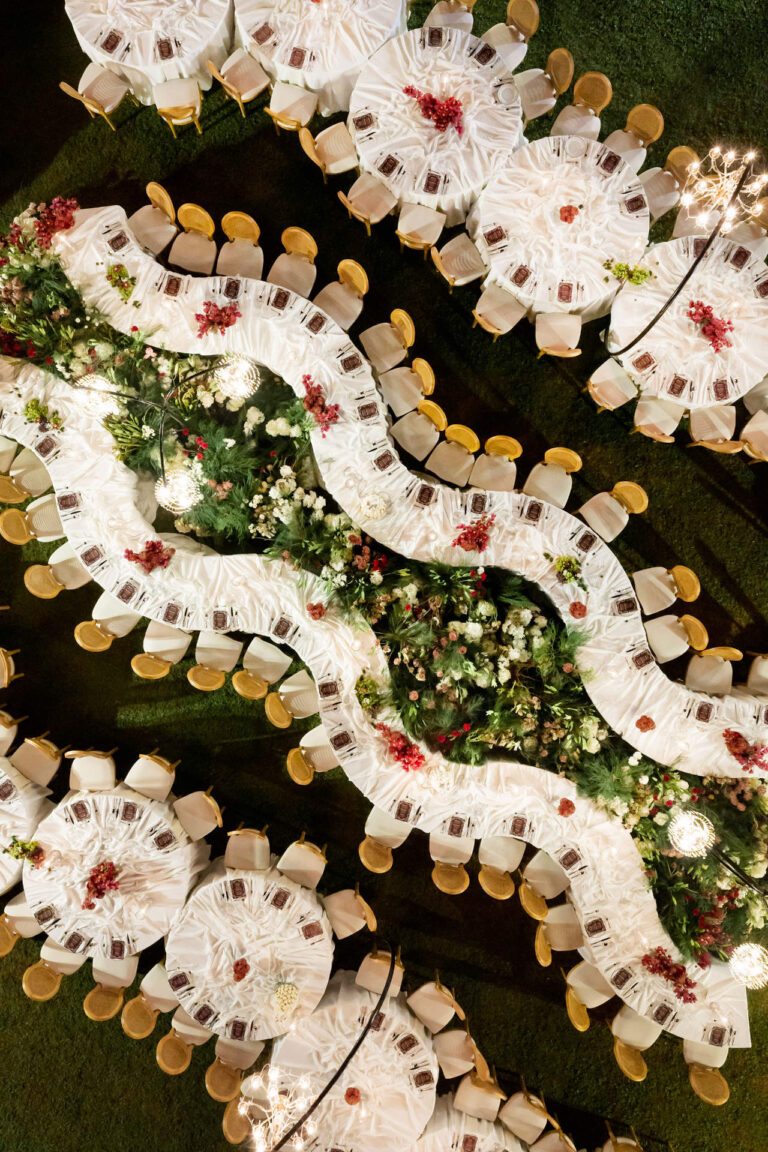Serpentine tables of white linen and flowers seen from directly above, The Wedding Bliss - Thailand