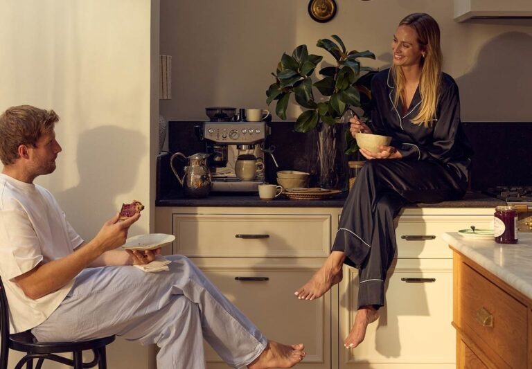 A couple chatting over breakfast in their kitchen, The Wedding Shop