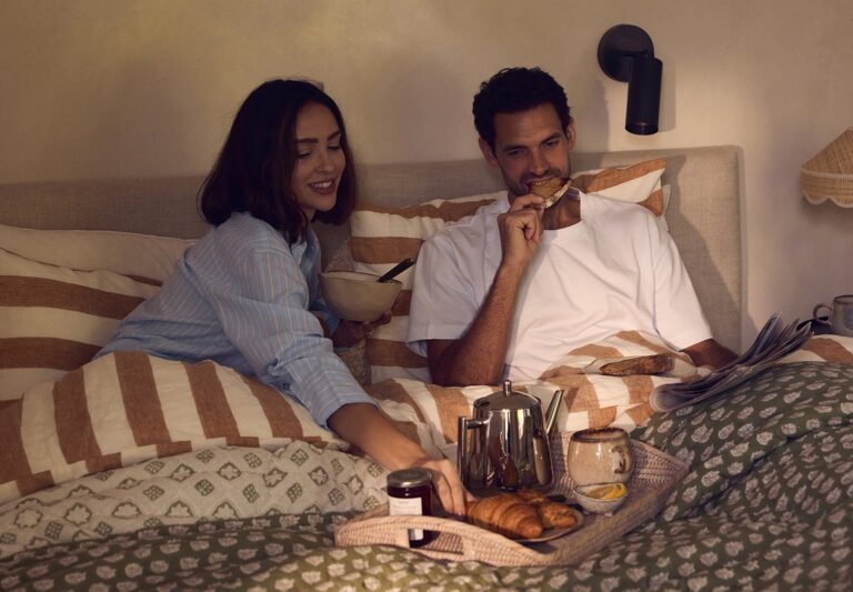 A couple eating breakfast in bed, The Wedding Shop