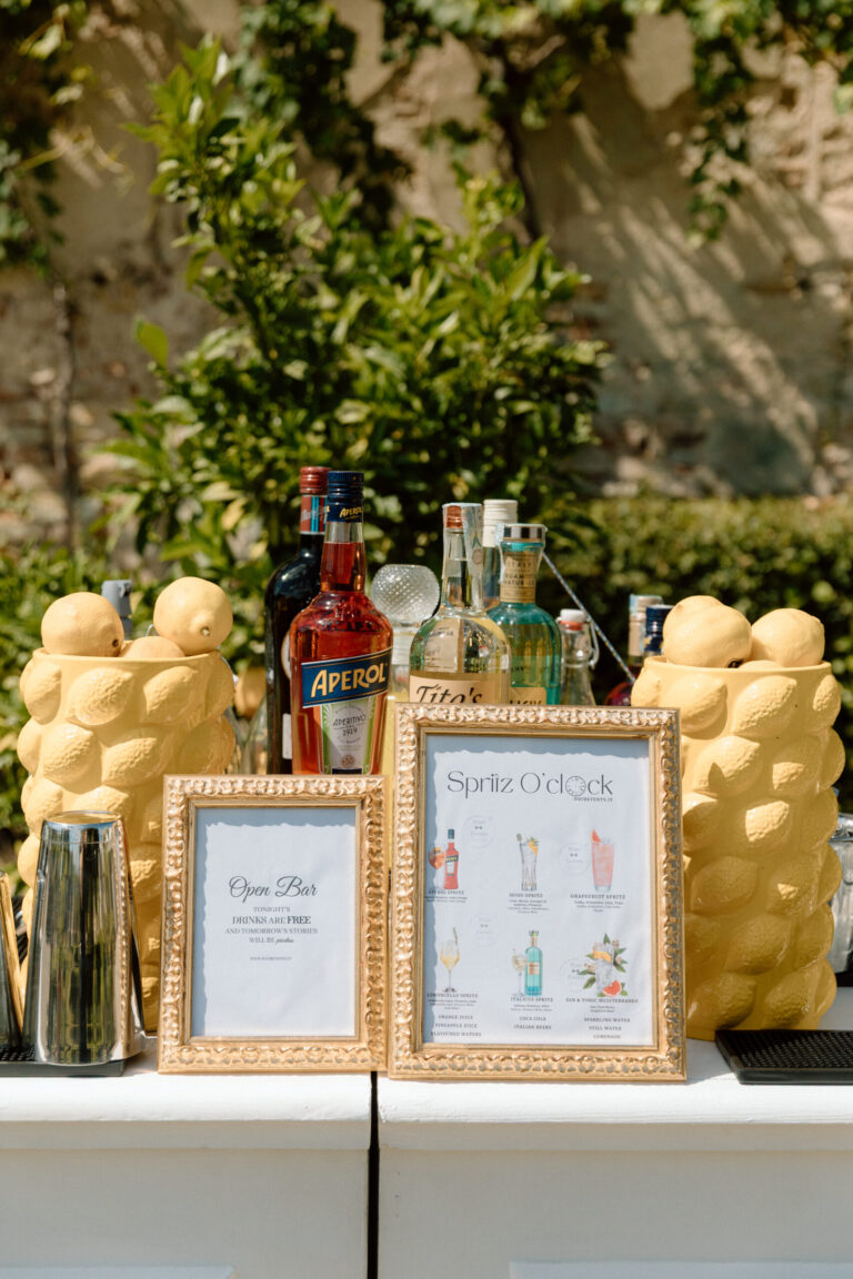 Lemon-themed drinks bar with framed menus in the garden, Villa Corsini a Mezzomonte, TheKnotInItaly