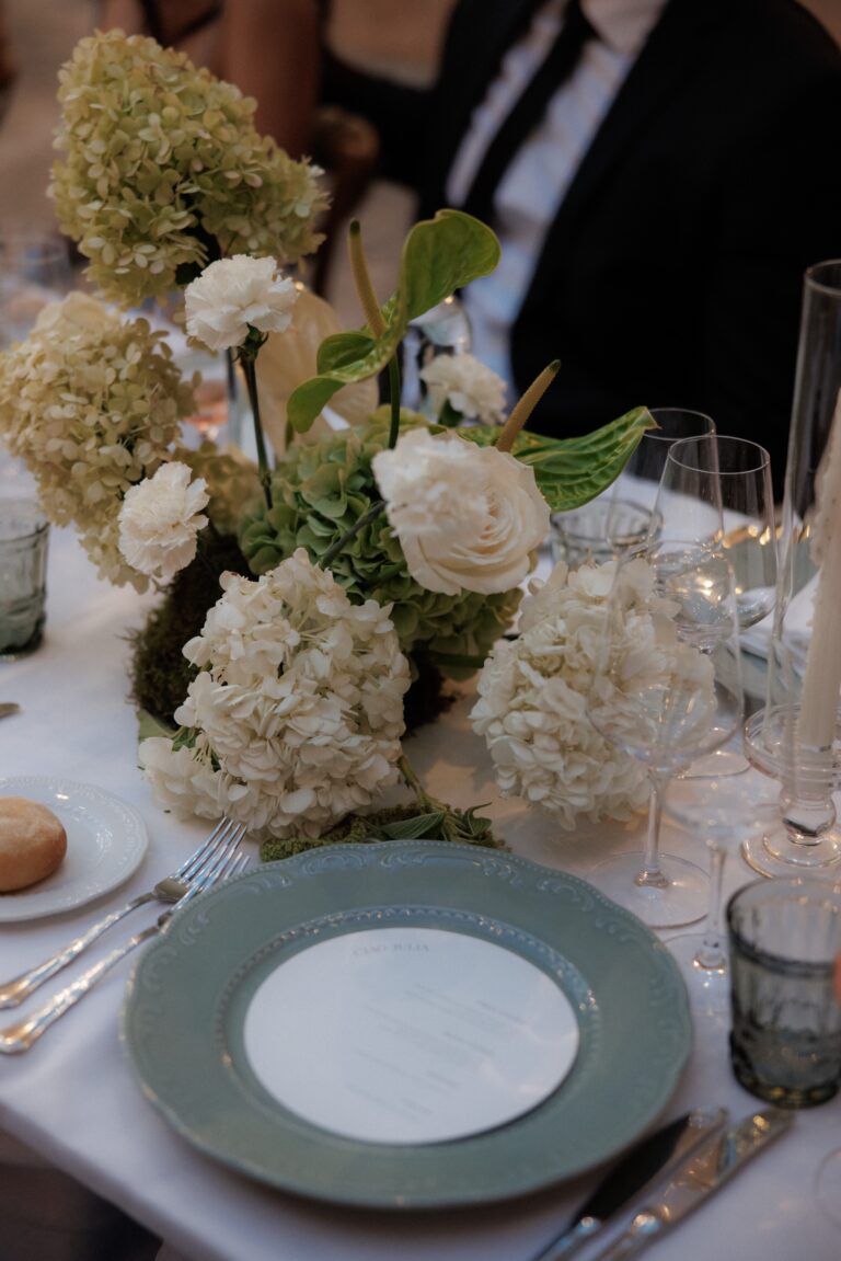 Hydrangeas, white roses and green-rimmed plates on the dinner table, Masseria Salamina, Puglia, TheKnotInItaly