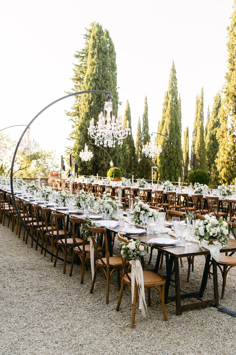 Long tables beneath the cypresses on the terrace at Castello di Vicchiomaggio, Chianti, TheKnotInItaly