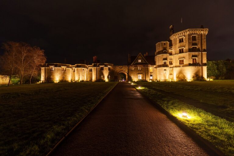 The floodlit approach and gatehouse range at night, Thornbury Castle