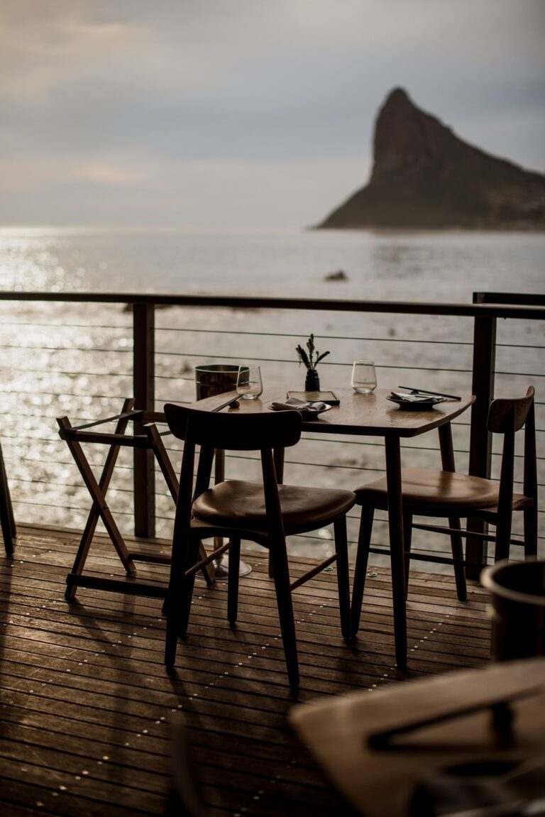 Chefs Warehouse, a laid table on the restaurant deck at dusk, Tintswalo Atlantic