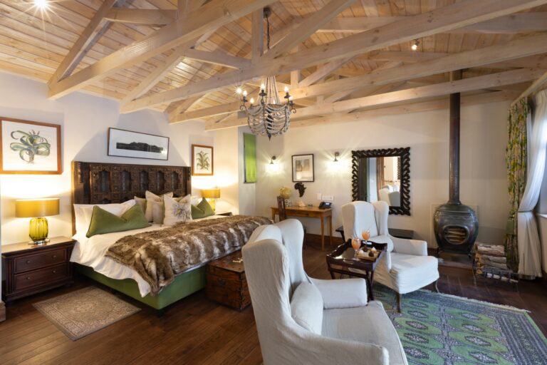 The Robben Island Suite, wing chairs and a wood-burning stove, Tintswalo Atlantic