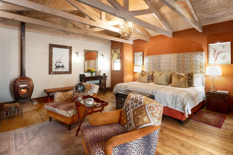 The Lamu Island Suite, a wood-burning stove and terracotta wall, Tintswalo Atlantic