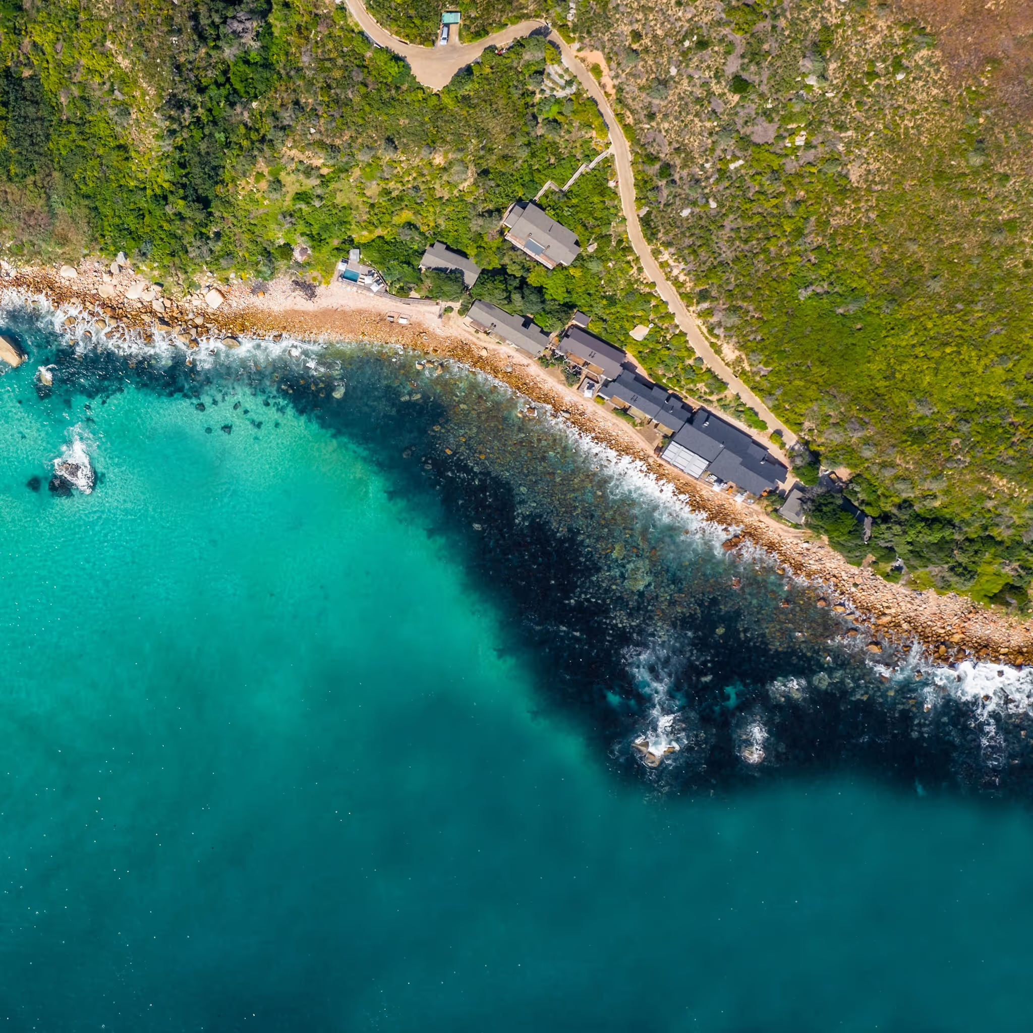Aerial view of the lodge on the rocky Atlantic shore, Tintswalo Lodges