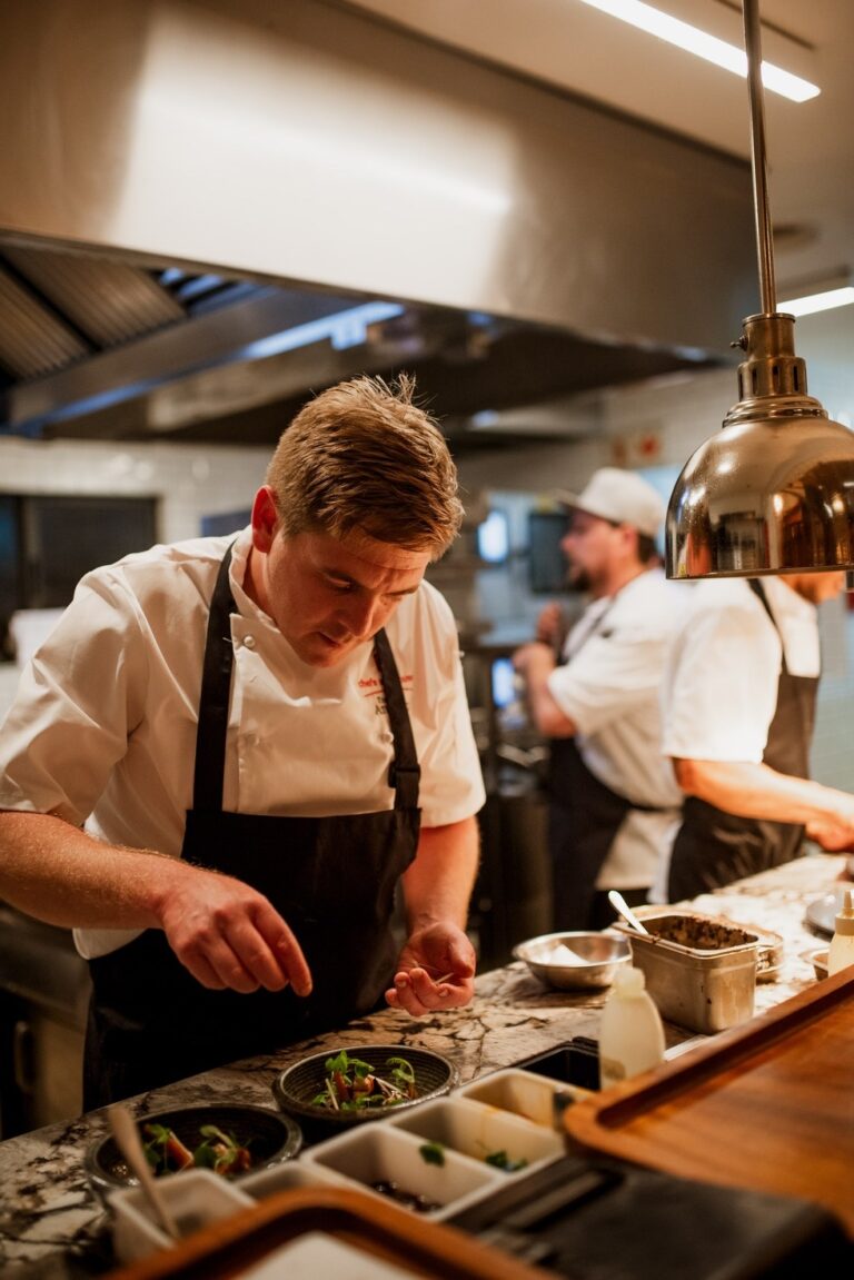 Chef preparing food in the restaurant kitchen, Tintswalo Lodges