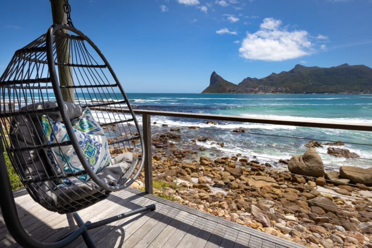 Hanging chair on a suite deck above the shoreline, Tintswalo Lodges