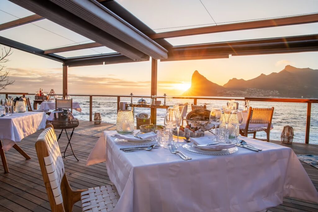 A table laid on the deck at sunset