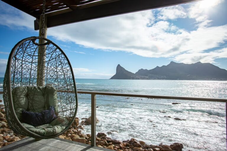 Hanging chair on a suite deck looking to the Sentinel, Tintswalo Lodges