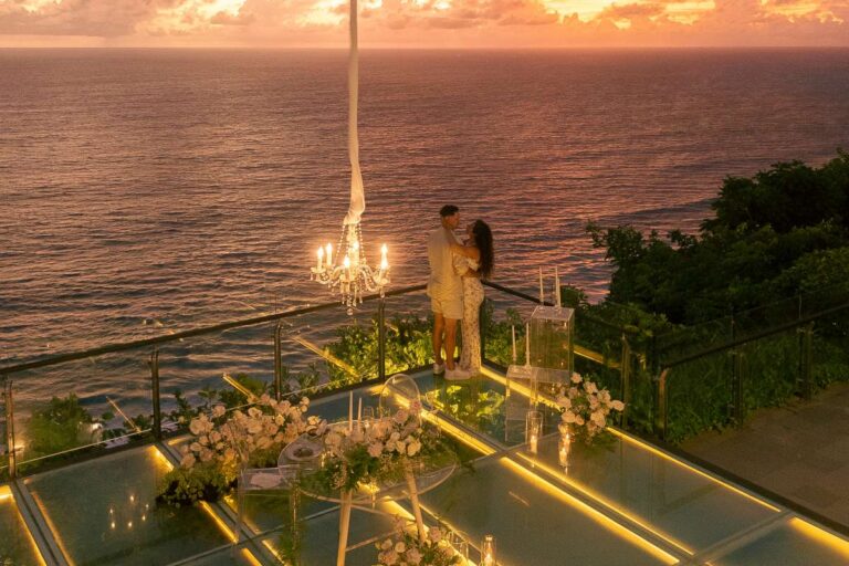 A couple on the Glass Stage at sunset, Tirtha Bridal