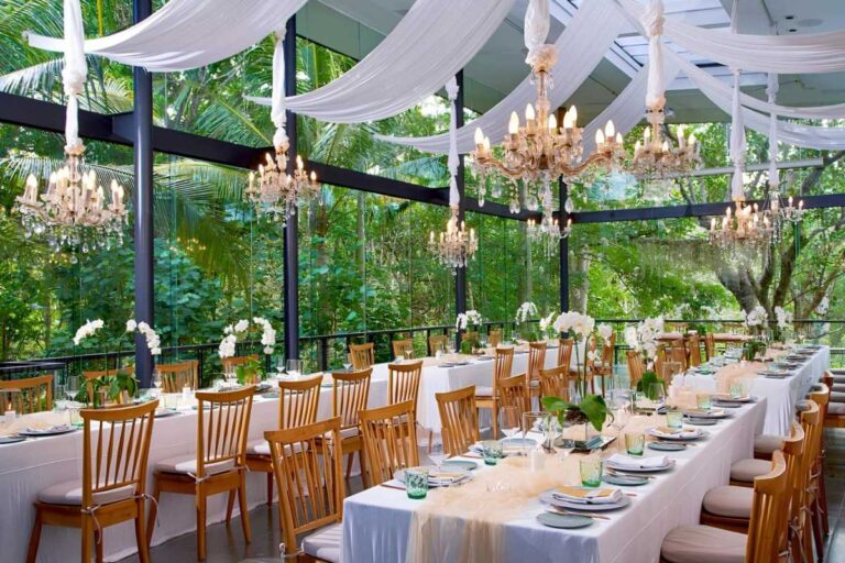 A long dinner table in the Plumeria Room, Tirtha Bridal