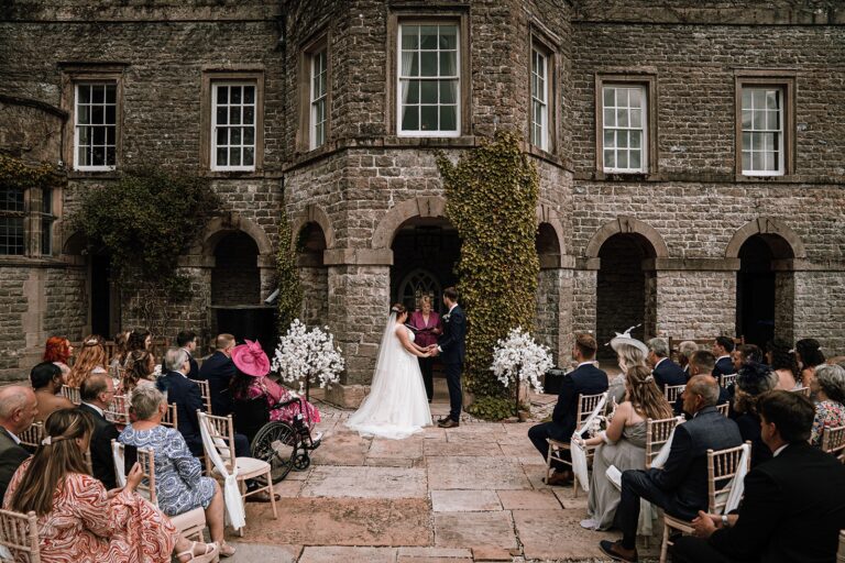 Ceremony in the stone Terrace Arcade courtyard, Tissington Hall