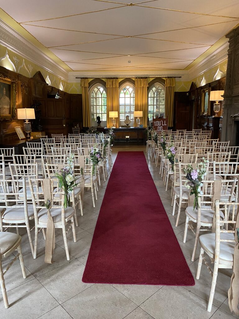 Panelled ceremony room with red-carpet aisle, Tissington Hall