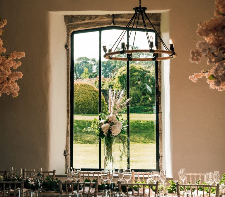 Long banquet table beneath the arched window, Tissington Hall