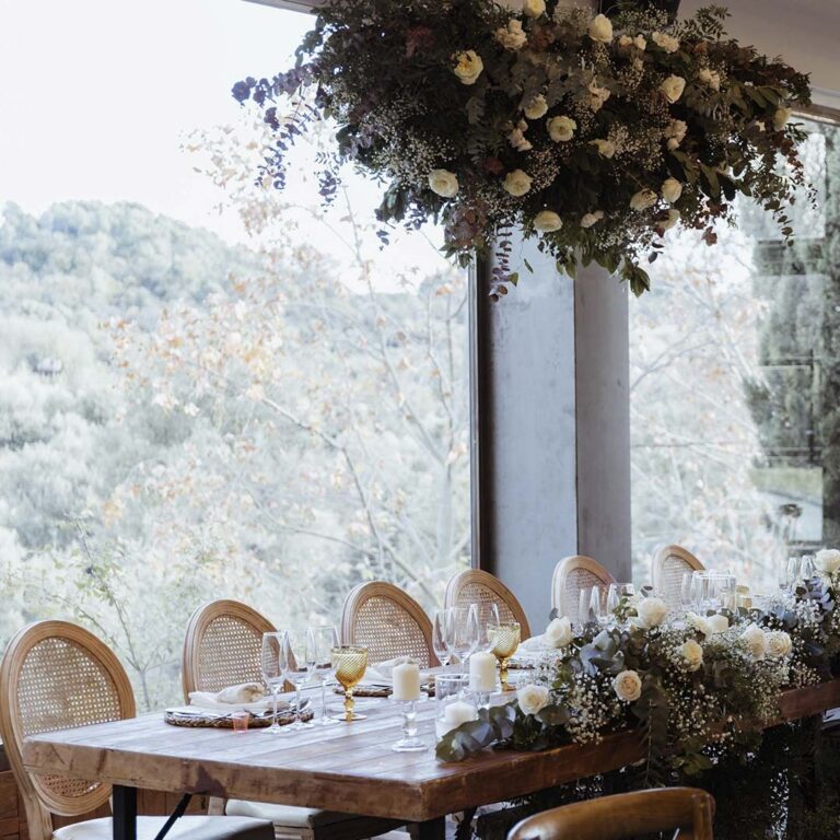 Hall table with hanging floral installation, Torre Sever