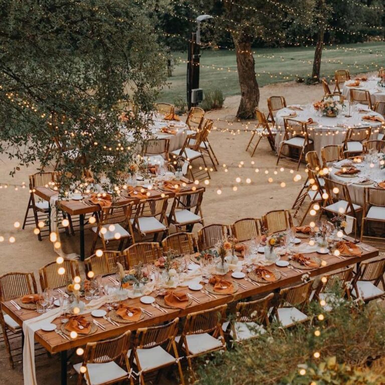 Outdoor dining area lit by string lights, Torre Sever