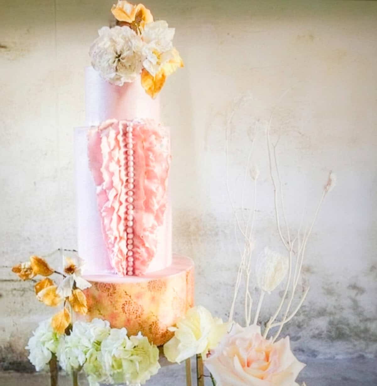 Luxury couture-inspired wedding cake with sculptural ruffles, pink tiers, and gold pattern at Villa Centinale in Tuscany, Italy., Tuscan Wedding Cakes