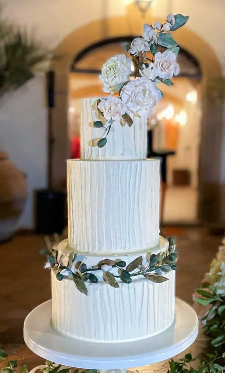White tiered wedding cake with handcrafted sugar olive branches and flowers at Tenuta di Sticciano, Tuscany, Tuscan Wedding Cakes