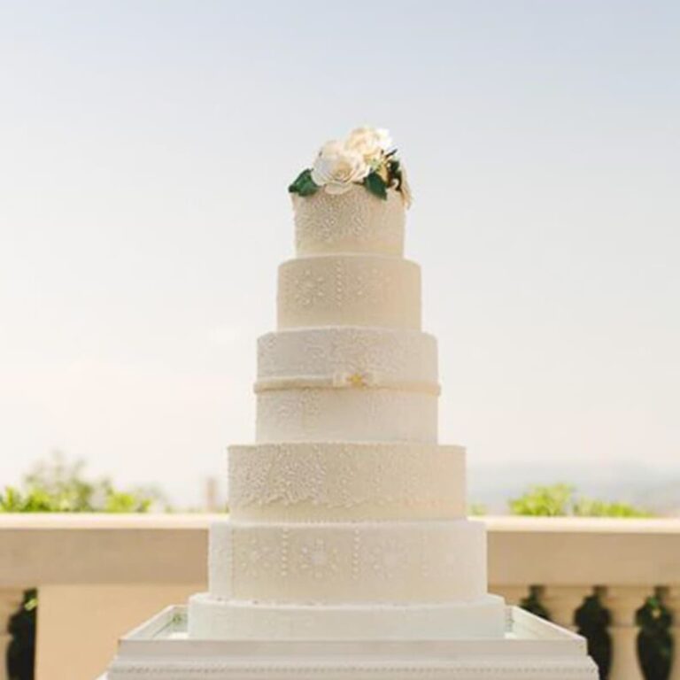 Five tier white wedding cake with delicate piped lace and beading, featured in Brides Magazine, Tuscan Wedding Cakes